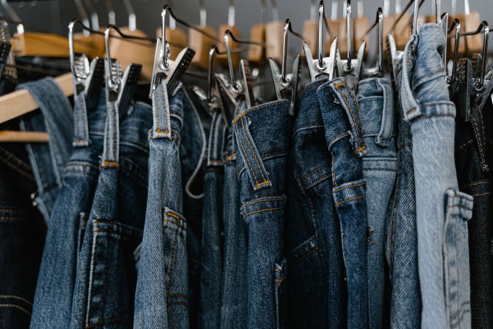 Faded selvedge denim jeans hanging on a shop rack