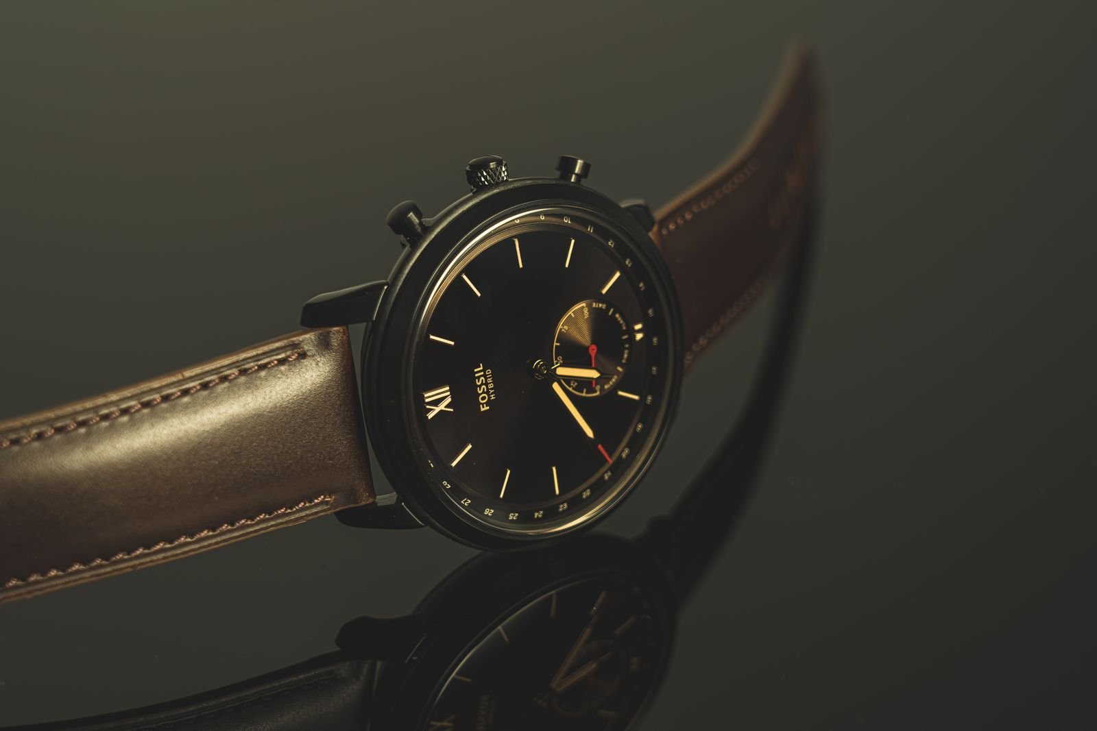 Vintage chronograph watch on a worn leather strap